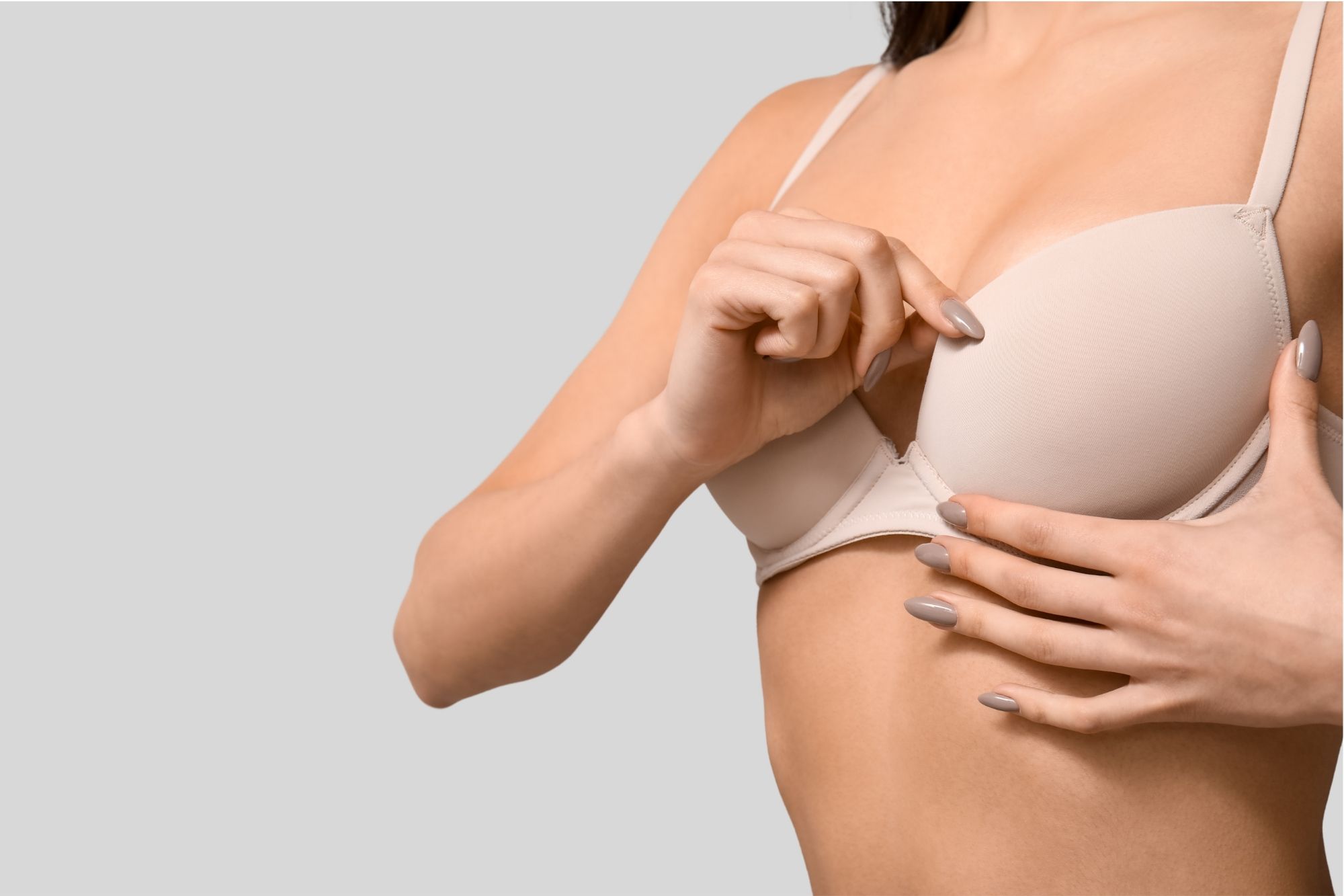 Woman adjusting bra cup