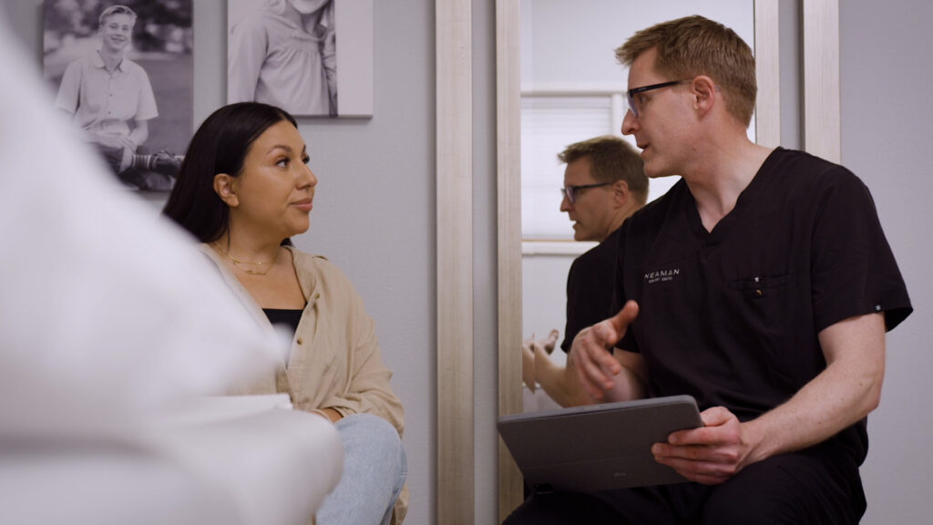 patient talking with surgeon