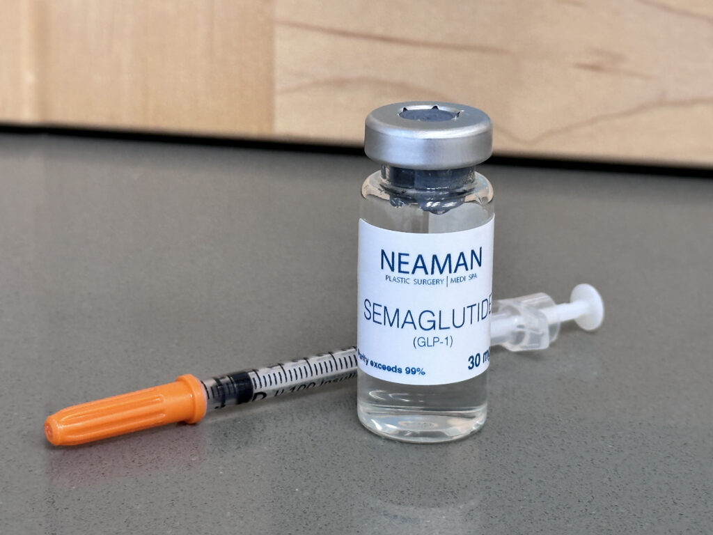 Photo of a vial of Semaglutide and a syringe on a counter