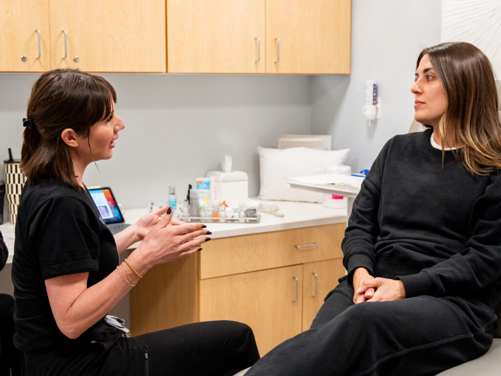 Nurse injector explains under eye Botox to patient