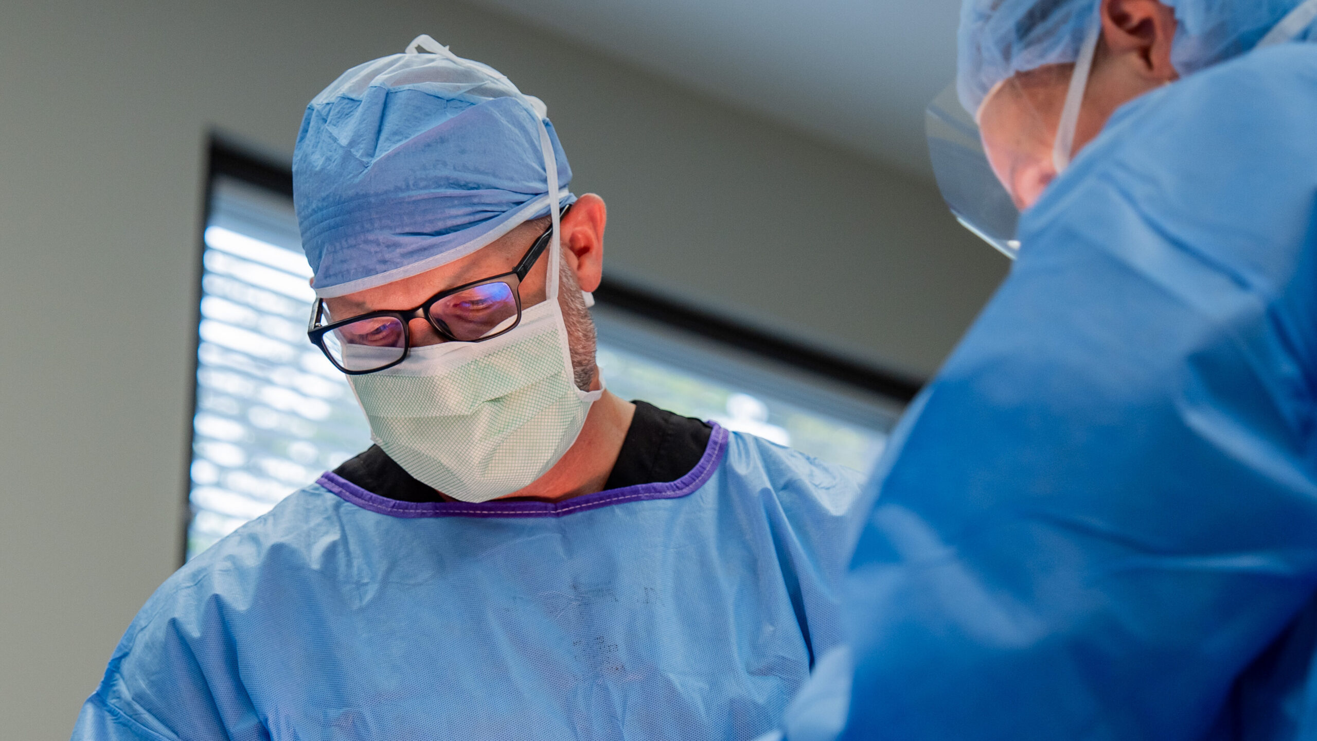 Surgeon performing breast surgery
