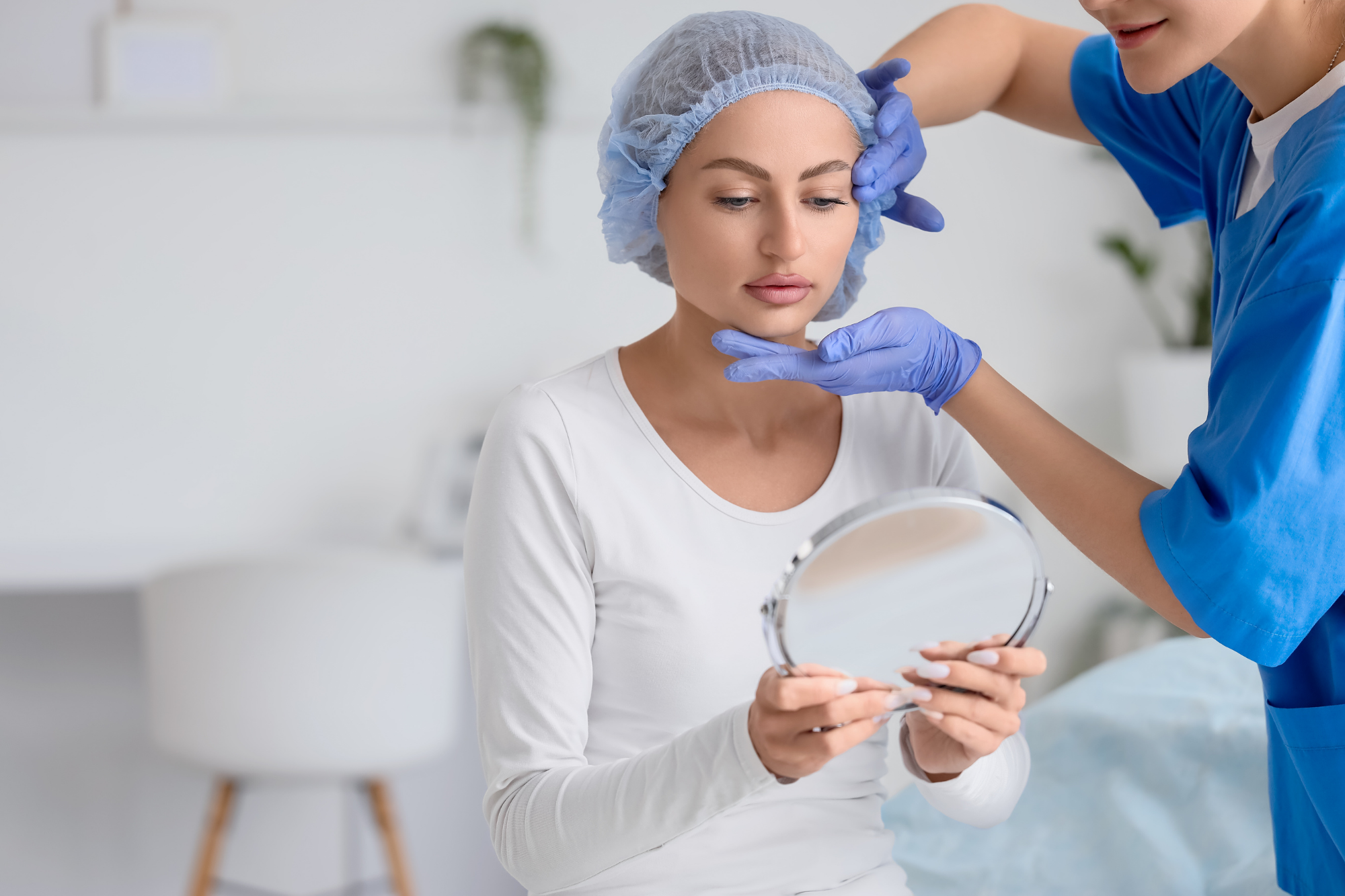 Woman looking into mirror eyelid lift